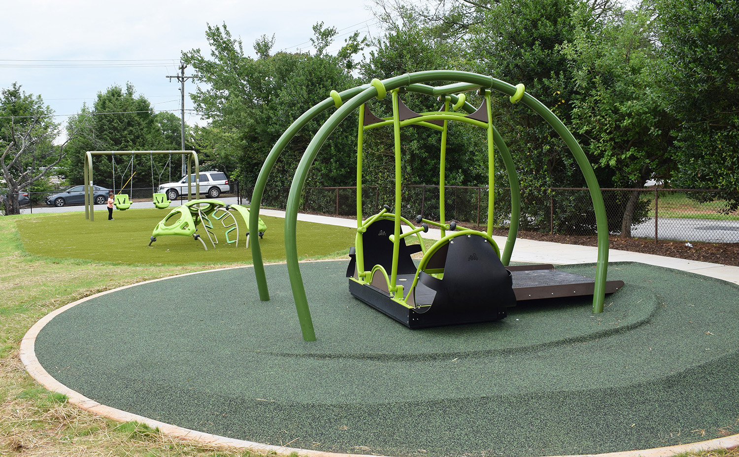 wheelchair-accessible playground at the new Highland Ave park