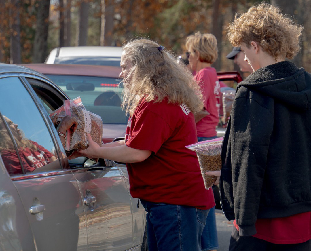Forsyth Animal Shelter and Forsyth Humane Society Employees and Volunteers accepting pet food donations